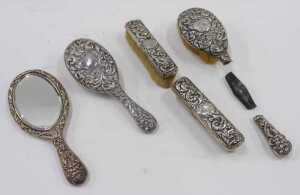 A Victorian harlequin silver five piece dressing table set, to include hairbrush repousse... - 2