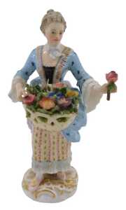 A 19thC German Meissen porcelain figure of a lady, dressed in finery holding basket of flowers,...