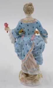 A 19thC German Meissen porcelain figure of a lady, dressed in finery holding basket of flowers,... - 2