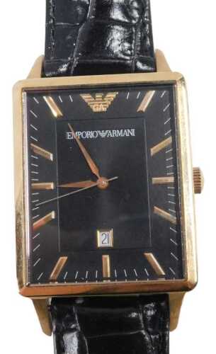 An Emporio Armani fashion watch, the 3cm wide rectangular face with gilt coloured baton pointers...