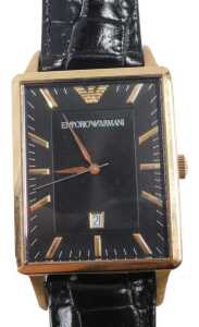 An Emporio Armani fashion watch, the 3cm wide rectangular face with gilt coloured baton pointers...