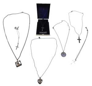 A group of silver chains and pendants, mainly religion related to include St Christopher,...