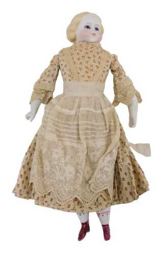 A 19thC bisque headed doll, with moulded hair, fixed eyes, closed mouth and with semi-porcelain...