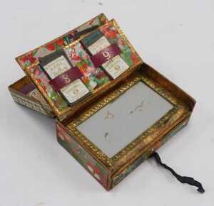 A 20thC cloisonne box, of oblong form, with domed lid, profusely decorated with flowering shrubs,... - 11