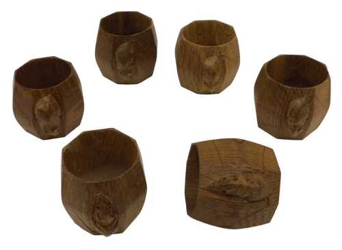 A set of six Robert 'Mouseman' Thompson of Kilburn napkin rings, of octagonal form, each carved...
