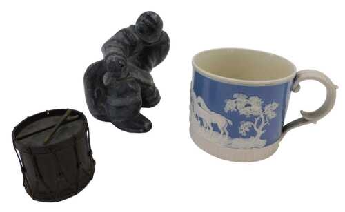 An Inuit carving, of a gentleman seated, unsigned, a 19thC Staffordshire pottery mug, raised...