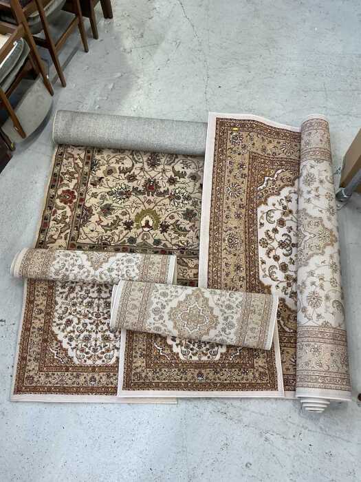 Various machine woven rugs.