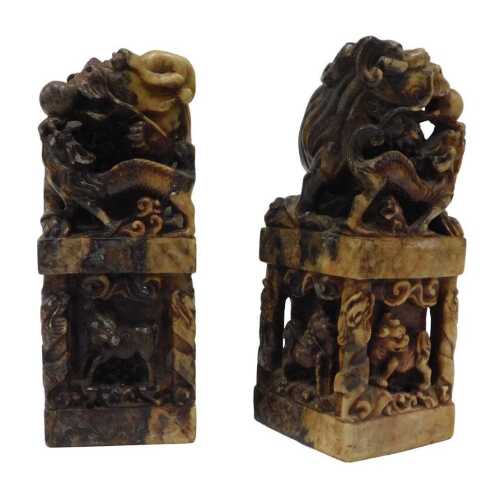 Two Chinese soapstone desk seal stamps, of rectangular form, profusely carved with dragons, orbs,...
