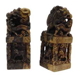 Two Chinese soapstone desk seal stamps, of rectangular form, profusely carved with dragons, orbs,...