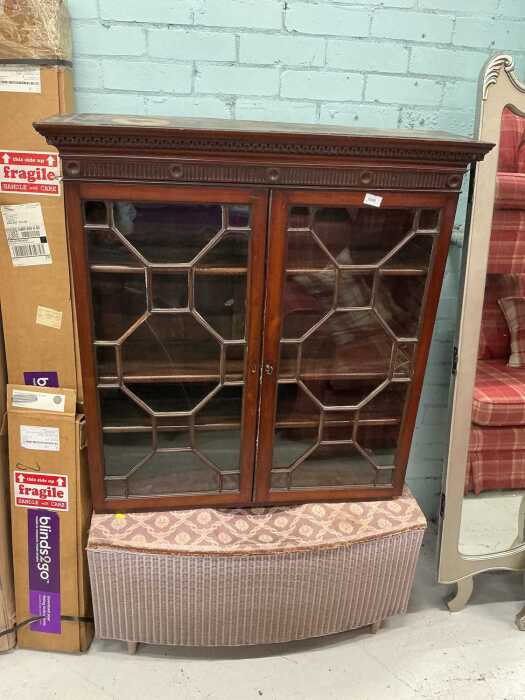 A mahogany hanging display cabinet, with astragal glazed door, and a Lloyd Loom style blanket box.