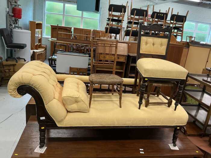 An Edwardian walnut stained chaise longue, upholstered in yellow material, similar decorated...