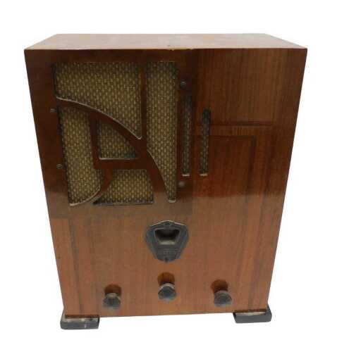 A mid 20thC walnut cased radio, on squat feet, 46cm high. 
WARNING! This lot contains untested...