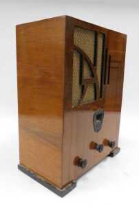 A mid 20thC walnut cased Ultra radio, on squat feet, 46cm high. WARNING! This lot contains... - 2