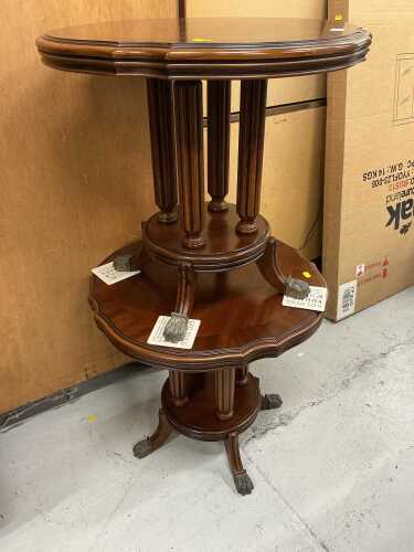 A pair of mahogany finish side tables, each with cross banded tops and stylised metal paw feet.