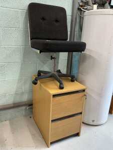 An Eames style office chair, with black part studded back, with chrome frame, on articulated...