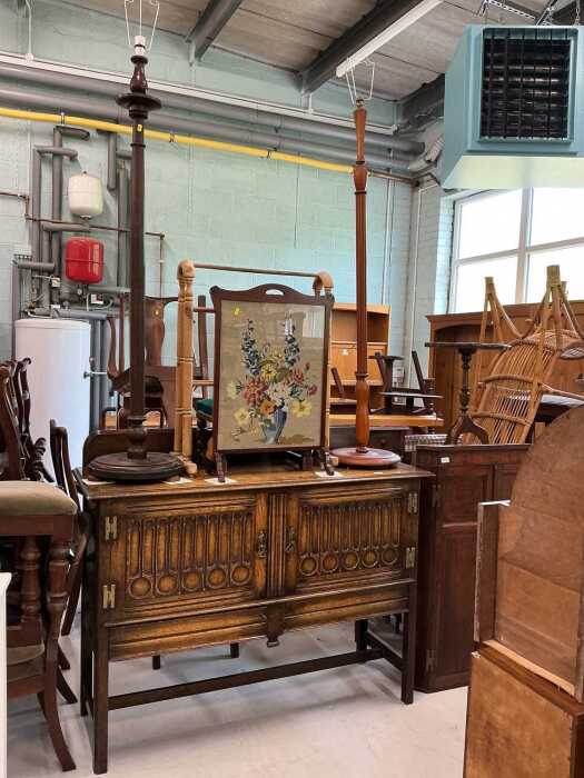 Various furniture, an early 20thC oak sideboard, with linen fold front, two standard lamps, fire...