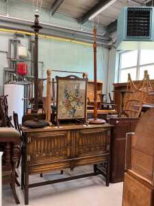 Various furniture, an early 20thC oak sideboard, with linen fold front, two standard lamps, fire...