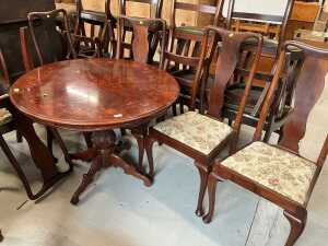 A late 20thC Italian dining table, of circular form, with printed leaf and scroll border, and...