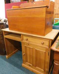 A pine lidded blanket box, with three part galleried back, and a pine desk.