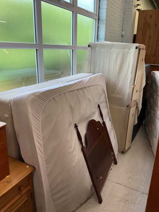 A double divan style bed with drawers, with mattress, and another floral single divan with...