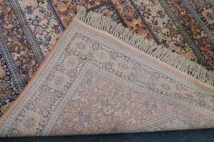 A 20th machine woven rug, the outer field with a geometric floral pattern, in cream, the inner... - 3