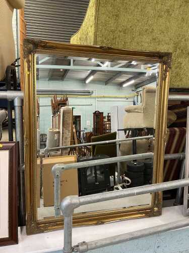 A large rectangular hanging mirror, with bevelled glass.