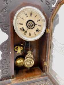 A late 19thC oak cased American gingerbread clock, the 13cm diameter Roman numeric dial marked... - 2