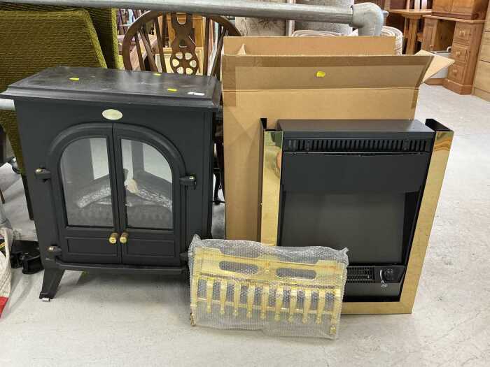V - A Dimplex electric fire, in black, with front arched double door opening and further electric...