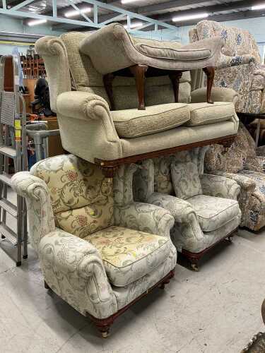 A matched lounge suite, comprising two seater settee and two armchairs, each in floral material,...