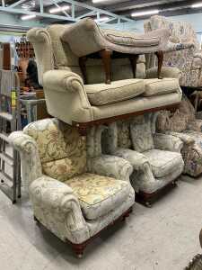 A matched lounge suite, comprising two seater settee and two armchairs, each in floral material,...