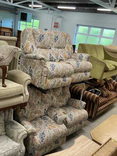 A three piece lounge suite, comprising two seater settee and two armchairs, in floral material....
