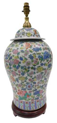 A 19thC style Chinese famille rose porcelain table lamp vase, the domed cover with metal fitting...