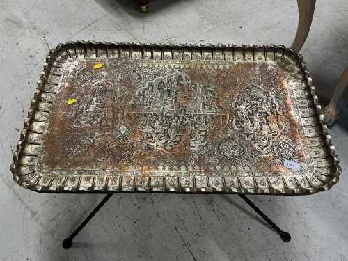 A highly decorative Eastern coffee table, with metal top, on an entwined iron stand.