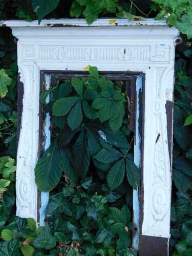 A 19thC cast iron fire surround, painted white.