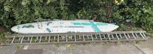 A Masterclass Brian Hide with J Frahne Artwork windsurfing board, and various step ladders.