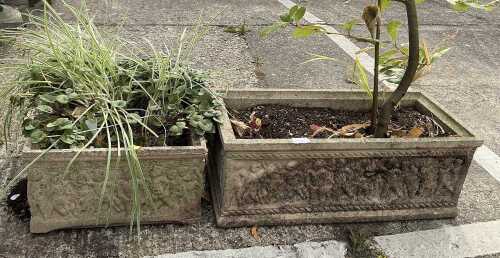 A concrete rectangular planter, and a further trough.
