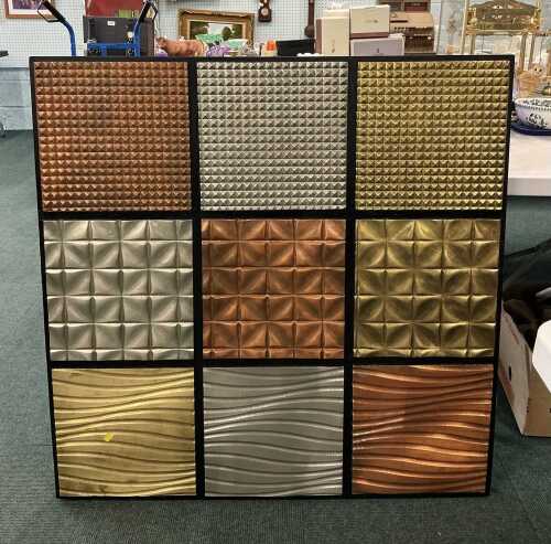 V - A Peppermill Interiors wall hanging, of square form, with lattice shapes in copper, silver and...