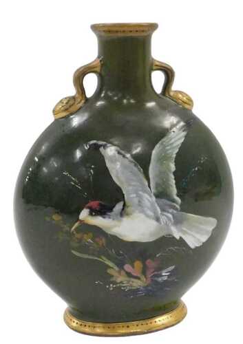 A Victorian aesthetic movement pottery moon flask, handpainted to one side with flowers and with...