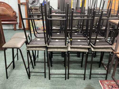 V - Eighteen catering or pub stools, with grey leatherette overstuffed tops, on metal frames. Note:...