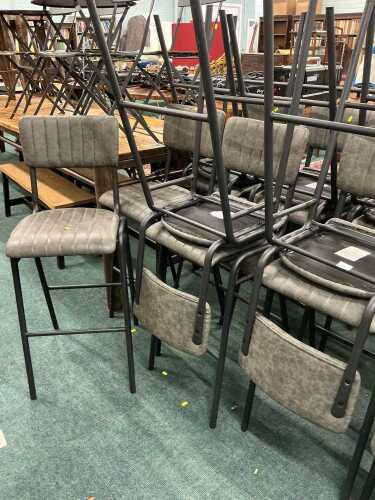 V - A set of twelve pub or catering chairs, with grey textured leatherette backs and seats. Note:...