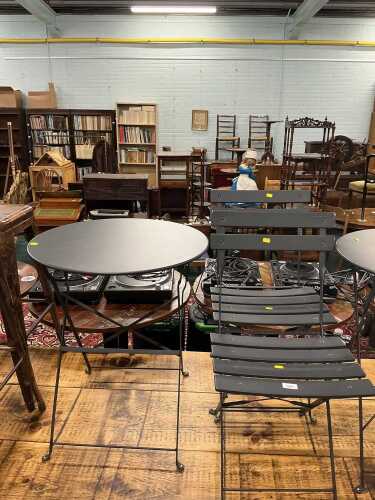 V - An outside catering pub or patio metal framed table, and two chairs. Note: VAT is payable on the...