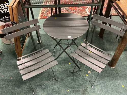 V - An outside catering pub or patio metal framed table, and two chairs. Note: VAT is payable on the...