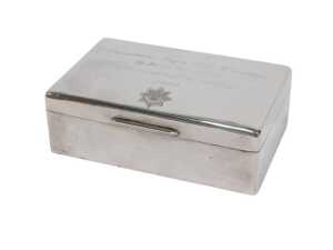 A George VI silver cigarette box, of oblong form with thumb mould handle, cedar lined interior,...