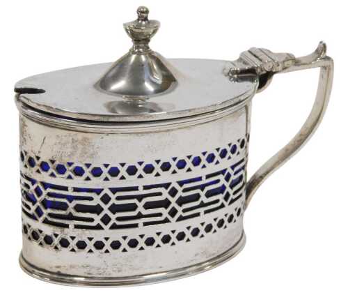 A George V silver mustard pot, of oval form, with urn finial, thumb mould handle and part...