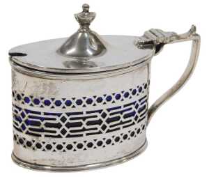 A George V silver mustard pot, of oval form, with urn finial, thumb mould handle and part...