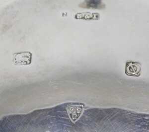 A George VI silver three footed salt, with shaped rim, silver gilt interior, plain circular body... - 2