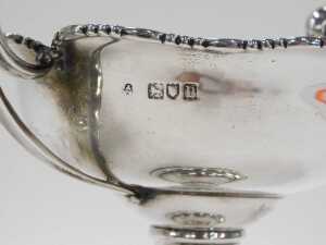A pair of late Edward VII silver bonbon dishes, each with scroll handles, flared floral rims,... - 3