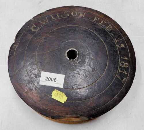 A George IV 19thC wooden industrial reel, marked C Wilson February 15th 1817, 23cm diameter.