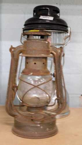 A Tilley lamp, and another.