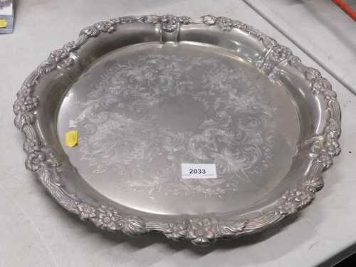 A 20thC silver plated dish, of shaped circular form, the inner section with a chased scroll and...